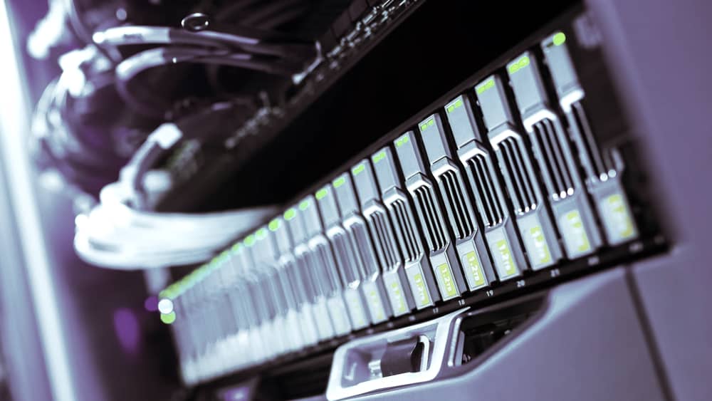 Blue-lit computer server rack in a data centre