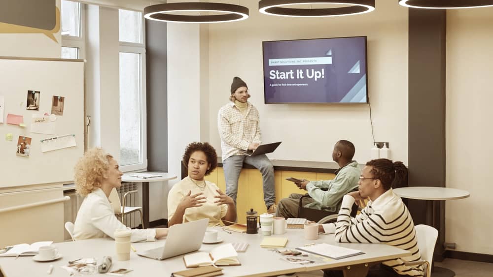 Diverse group discussing startup ideas in a creative office